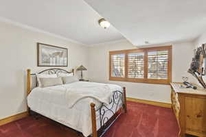 Flex Room/Bedroom with dark colored carpet and crown molding