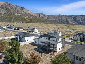 Aerial perspective of suburban area with a mountain backdrop