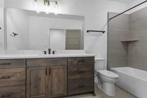 Bathroom featuring vanity and shower / bath combination