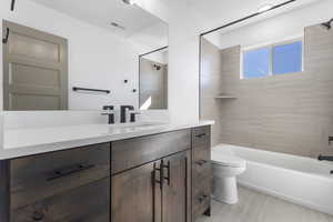 Full bath featuring shower / washtub combination and vanity