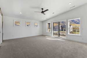 Unfurnished room featuring recessed lighting, a ceiling fan, carpet floors, and lofted ceiling