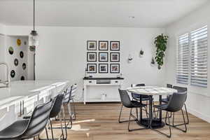 Dining area featuring light wood-style floors