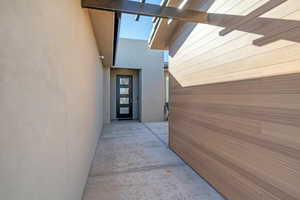 Property entrance with stucco siding