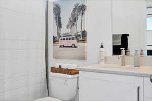 Bathroom featuring vanity and a shower with shower curtain