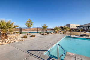 Community pool featuring a patio and a mountain view
