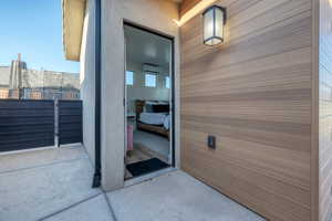 Doorway to property featuring a wall mounted AC