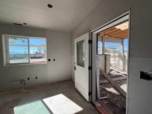 Looking out toward covered patio at basement entrance