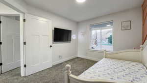 Carpeted bedroom with baseboards