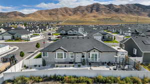 Aerial perspective of suburban area featuring a mountainous background