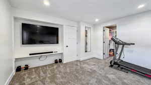 Exercise room featuring carpet floors and recessed lighting