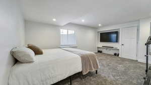 Carpeted bedroom featuring recessed lighting and baseboards