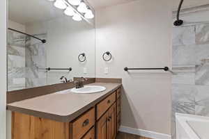Bathroom with vanity and dark wood-style floors