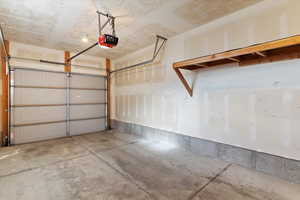 Garage featuring a garage door opener