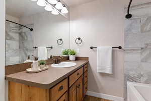 Bathroom featuring vanity and dark wood-style floors