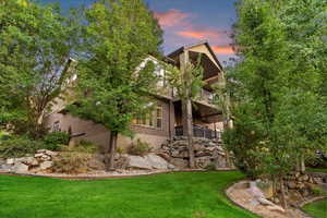 View of green lawn with a balcony