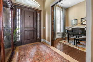 Entrance foyer featuring tile patterned floors and healthy amount of natural light