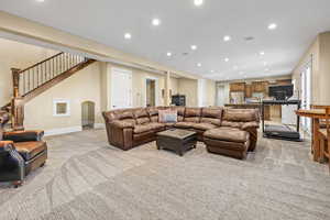 Living room featuring recessed lighting and light colored carpet