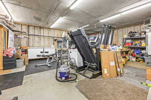 Basement with a workshop area and a heating unit