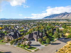 Aerial perspective of suburban area with a mountainous background