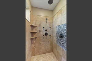 Bathroom with a tile shower