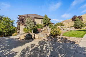 View of side of property featuring stucco siding