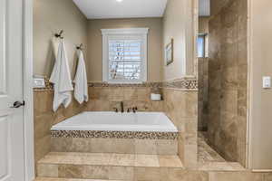 Bathroom with a garden tub and a walk in shower