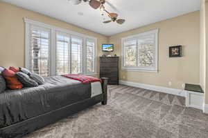 Bedroom with carpet and ceiling fan