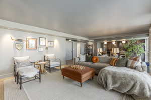 Living area featuring baseboards and wood finished floors