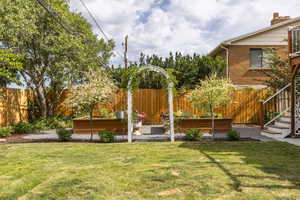 View of yard with a garden and stairway