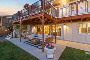 View of patio with a wooden deck