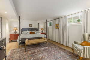 Bedroom with light wood finished floors and recessed lighting