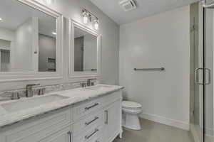 Main floor primary bathroom with double sink vanity
