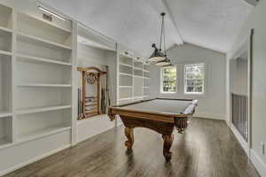 Playroom with billiards, wood finished floors, and built in features