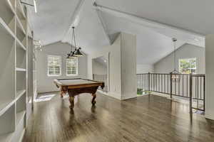 Game room featuring wood finished floors, a chandelier, and billiards table