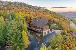 View of subject property with a forest and a mountainous background