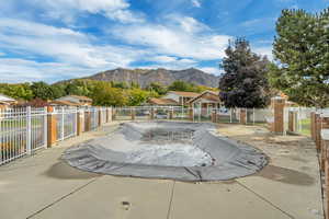 View of swimming pool featuring a mountain view and a patio area