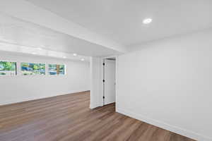 Basement featuring recessed lighting and wood finished floors