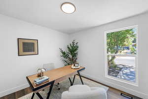 Office area featuring wood finished floors and baseboards