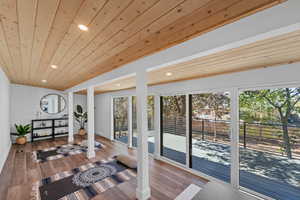Workout room with recessed lighting, wood ceiling, and wood finished floors