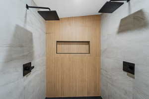 Bathroom featuring a tile shower