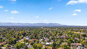 Aerial perspective of suburban area featuring a mountainous background