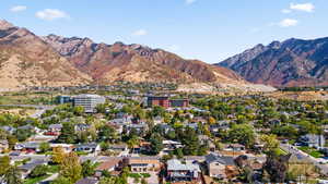 View of property location featuring a mountain backdrop and nearby suburban area