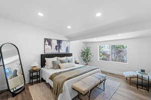 Bedroom featuring recessed lighting and wood finished floors