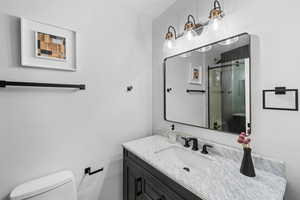 Bathroom with vanity and a stall shower