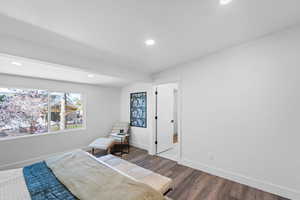 Bedroom with recessed lighting and wood finished floors