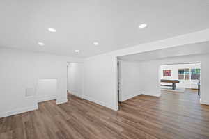 Empty room featuring pool table, recessed lighting, and wood finished floors