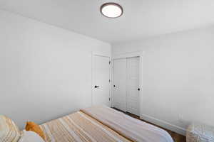 Bedroom featuring a closet and wood finished floors