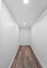 Unfurnished room featuring dark wood finished floors and recessed lighting
