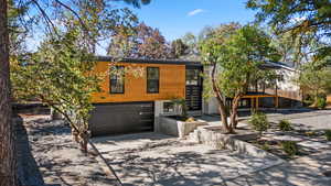 Contemporary house featuring driveway and a garage