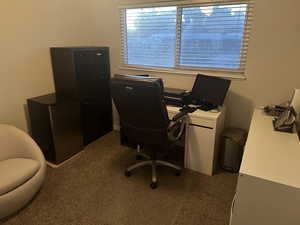 Office featuring dark colored carpet